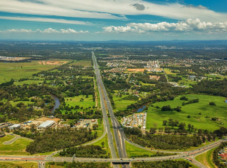 Aerial view of Caboolture and Bruce highway to Brisbane with Bri Aerial view of Caboolture and Bruce highway to Brisbane with Bri
