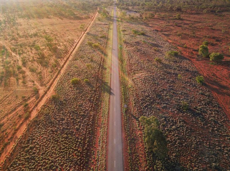 An aerial view of a long road in the Australian Outback. Empty roads during Covid 19.