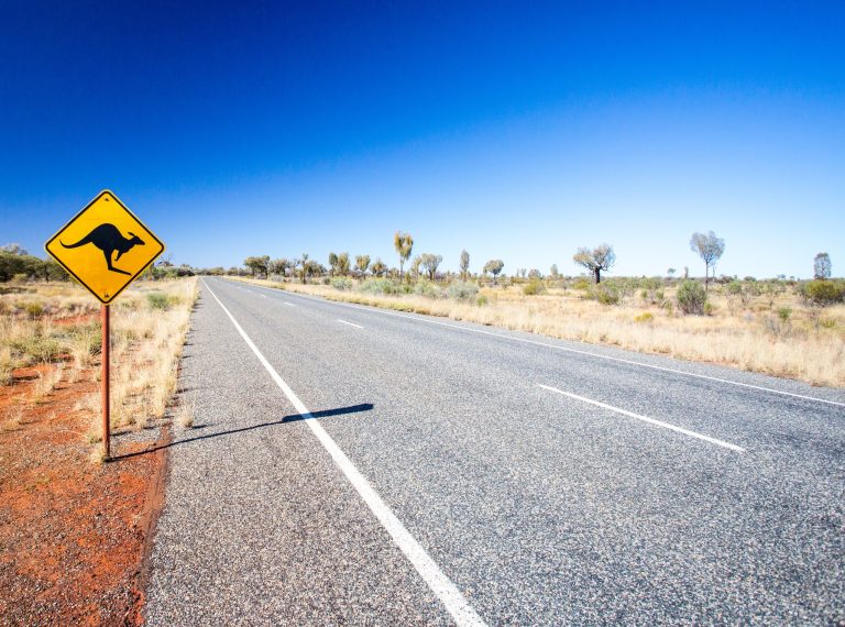 An iconic warning road sign for kangaroos near Uluru in Northern Territory, Australia An iconic warning road sign for kangaroos near Uluru in Northern Territory, Australia