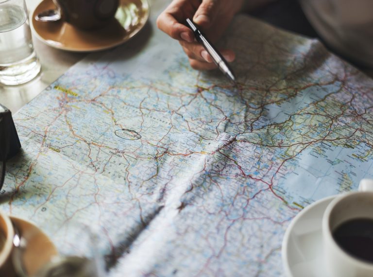 Closeup of road map planning travel journey Closeup of road map planning travel journey